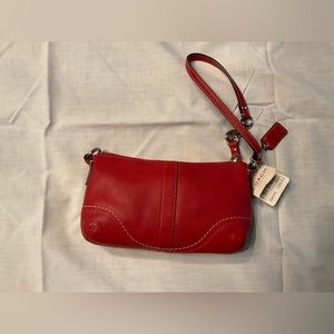 Coach red leather wristlet.